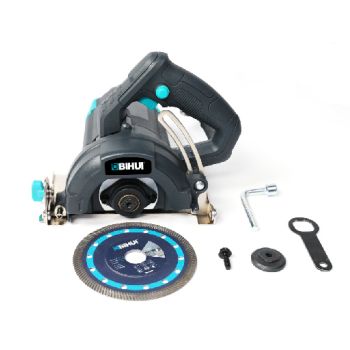 Electric Stone Cutter, blade, and installation tools sitting on a white surface.