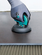 Professional tiler using a BIHUI hand tool